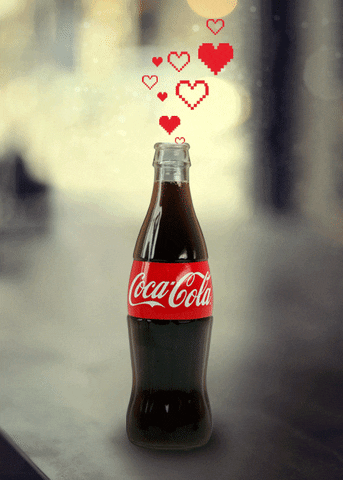 Bottle of Coca-Cola with hearts pouring out. 
