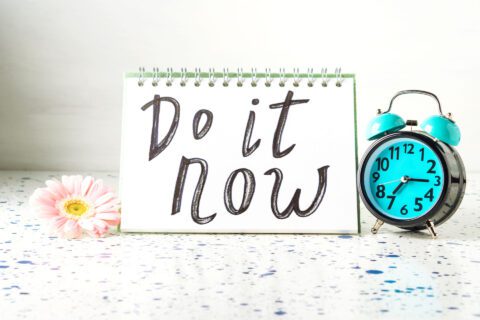 A sign with a clock next to it that says “Do It now”. A call to action if ever there was one. 